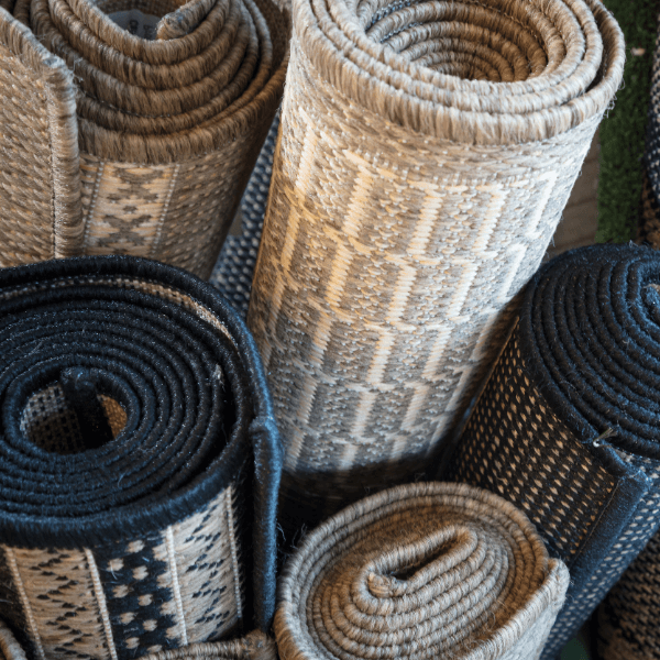 Rolled Blue, White, and Grey Rugs